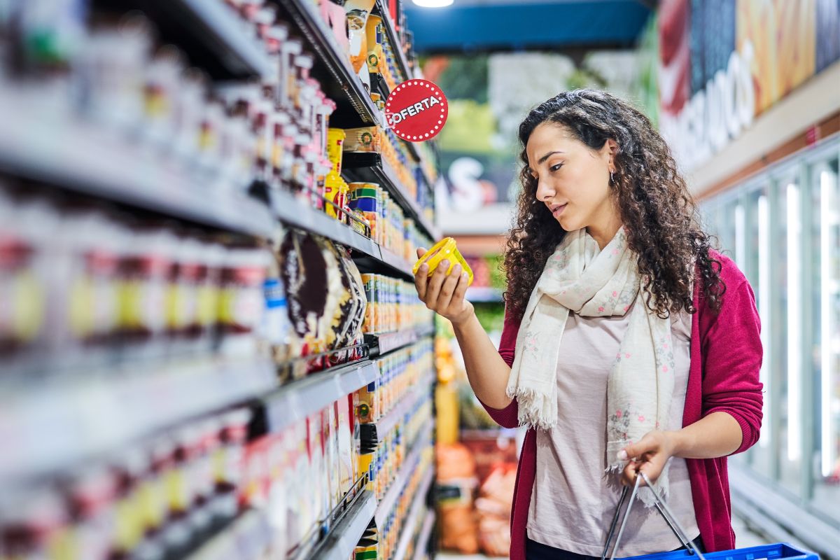 The image is about a lady grocery shopping at the store.