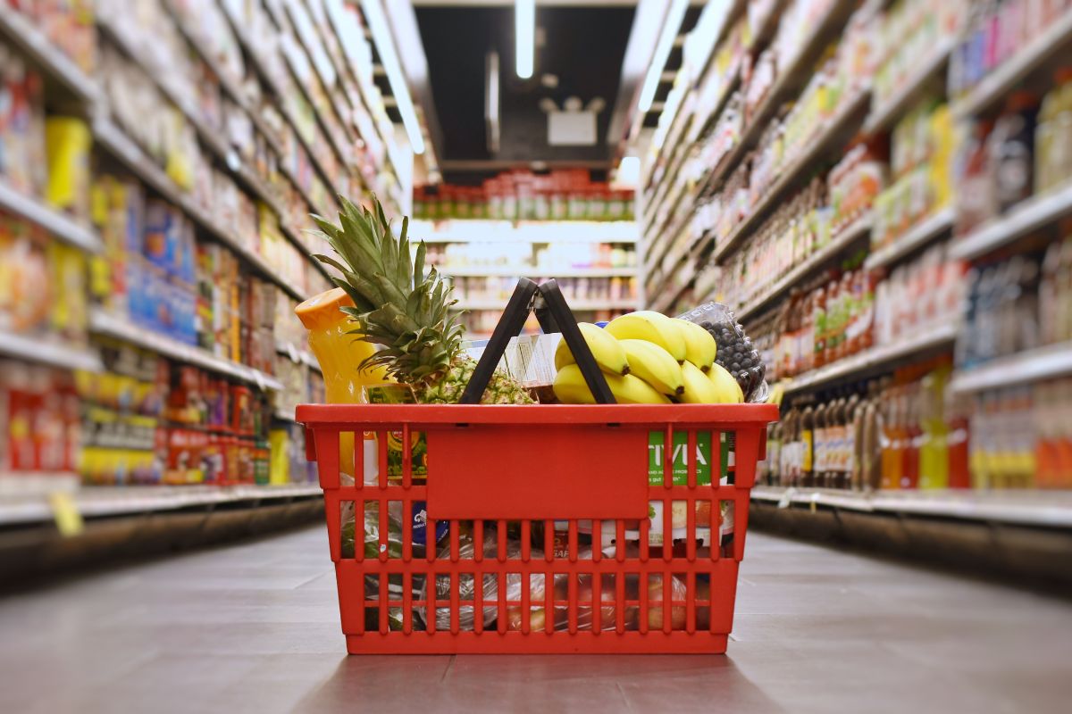The photo shows a basket with products at the store.