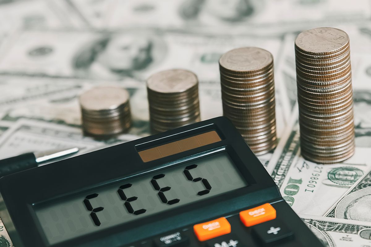 The image shows dollar bills for investment fees.