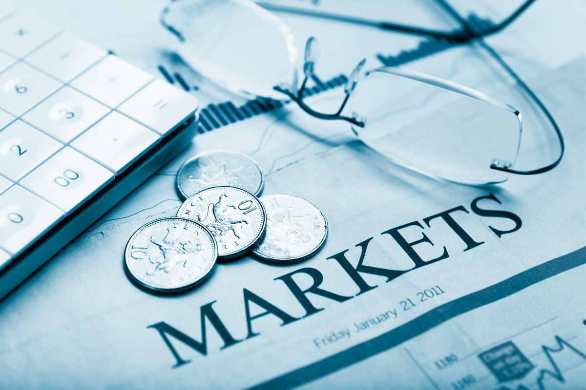 The photo is about papers with markets wording.