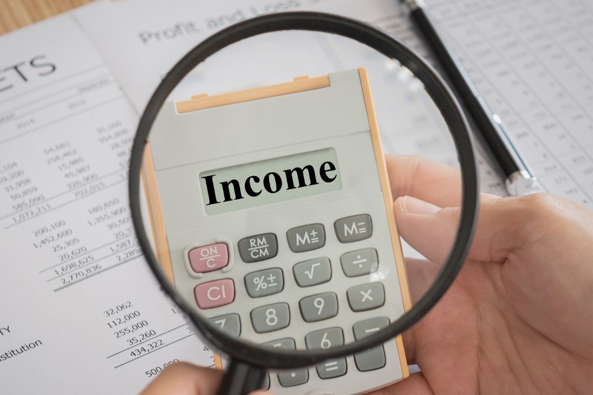The picture shows a man's hand building multiple income streams.