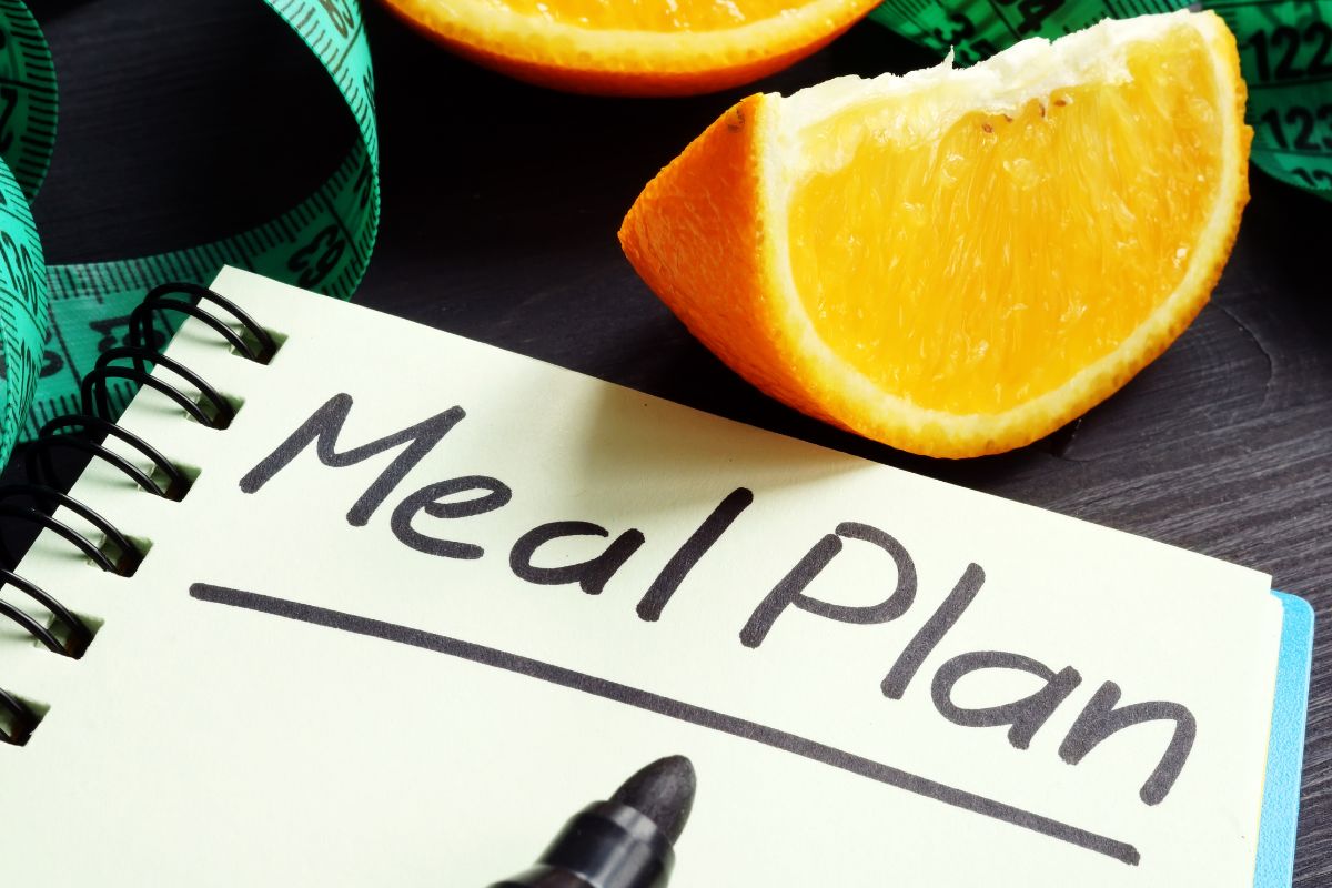 The photo shows a notebook with a meal plan wording.
