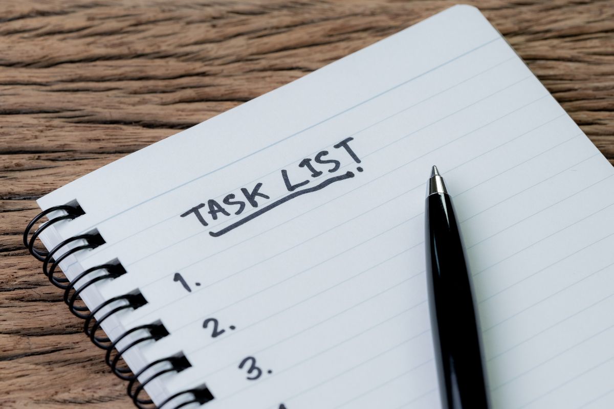 The photo shows a notebook with a low-priority task list.