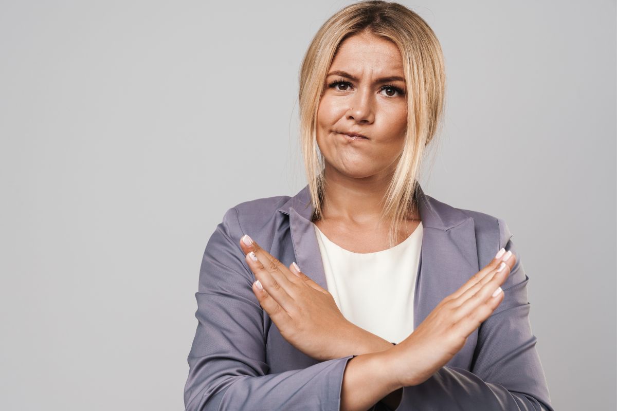 The photo shows a woman saying no to things.