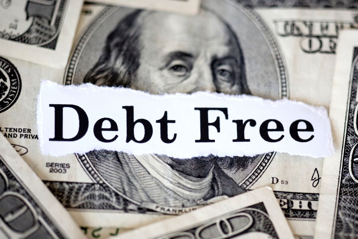 The image shows dollar bills and a debt-free wording.
