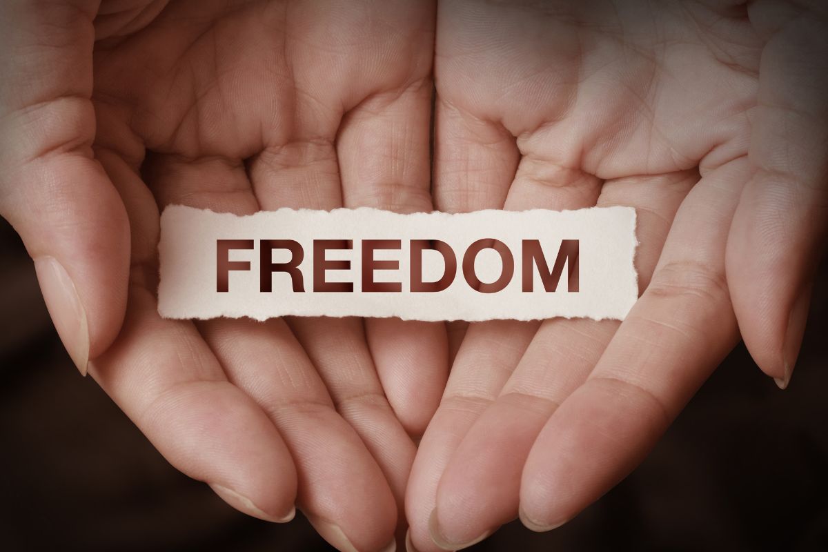 The picture shows a woman's hand with a freedom wording.