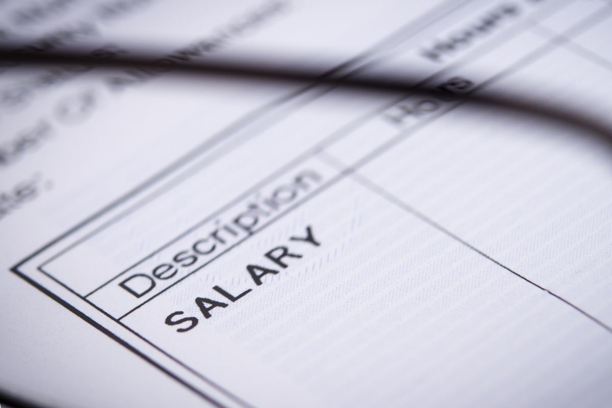 The image of a paper with a paycheck description.