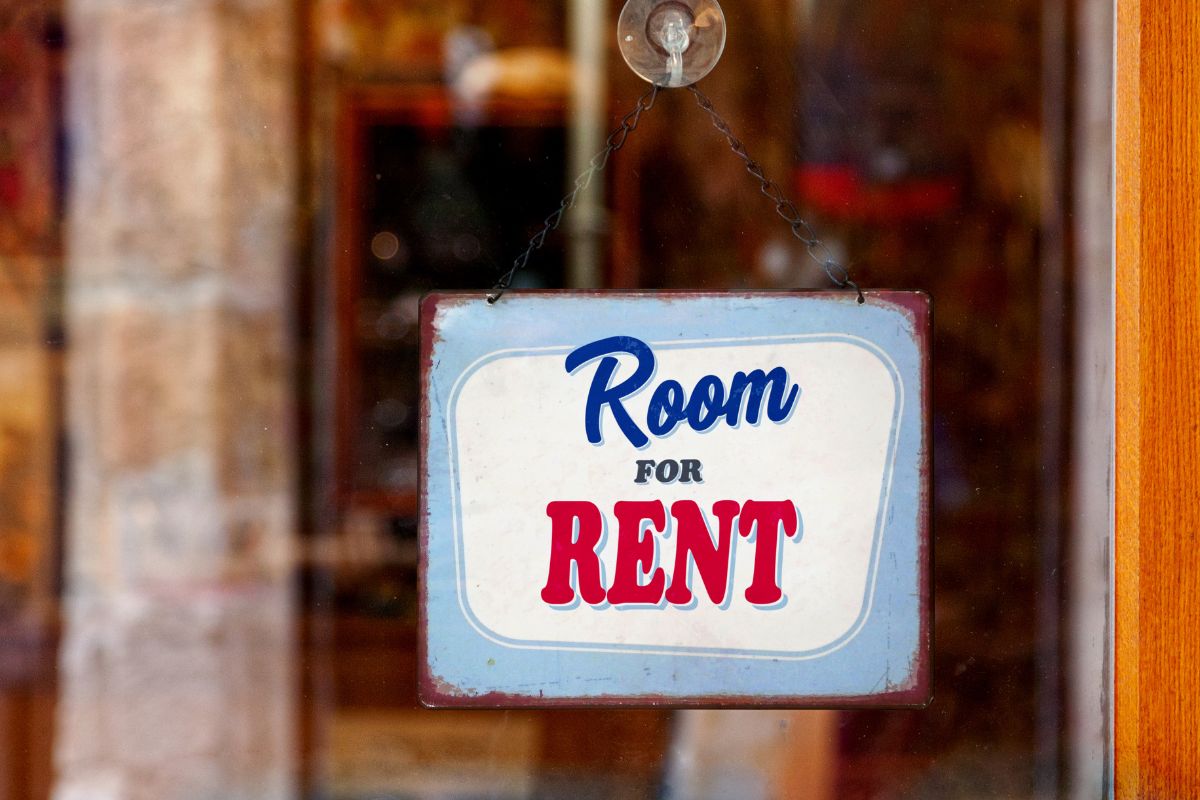 The image shows a sign for a room for rent.