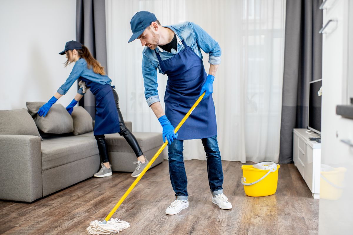 The picture of a worker offering house cleaning services.