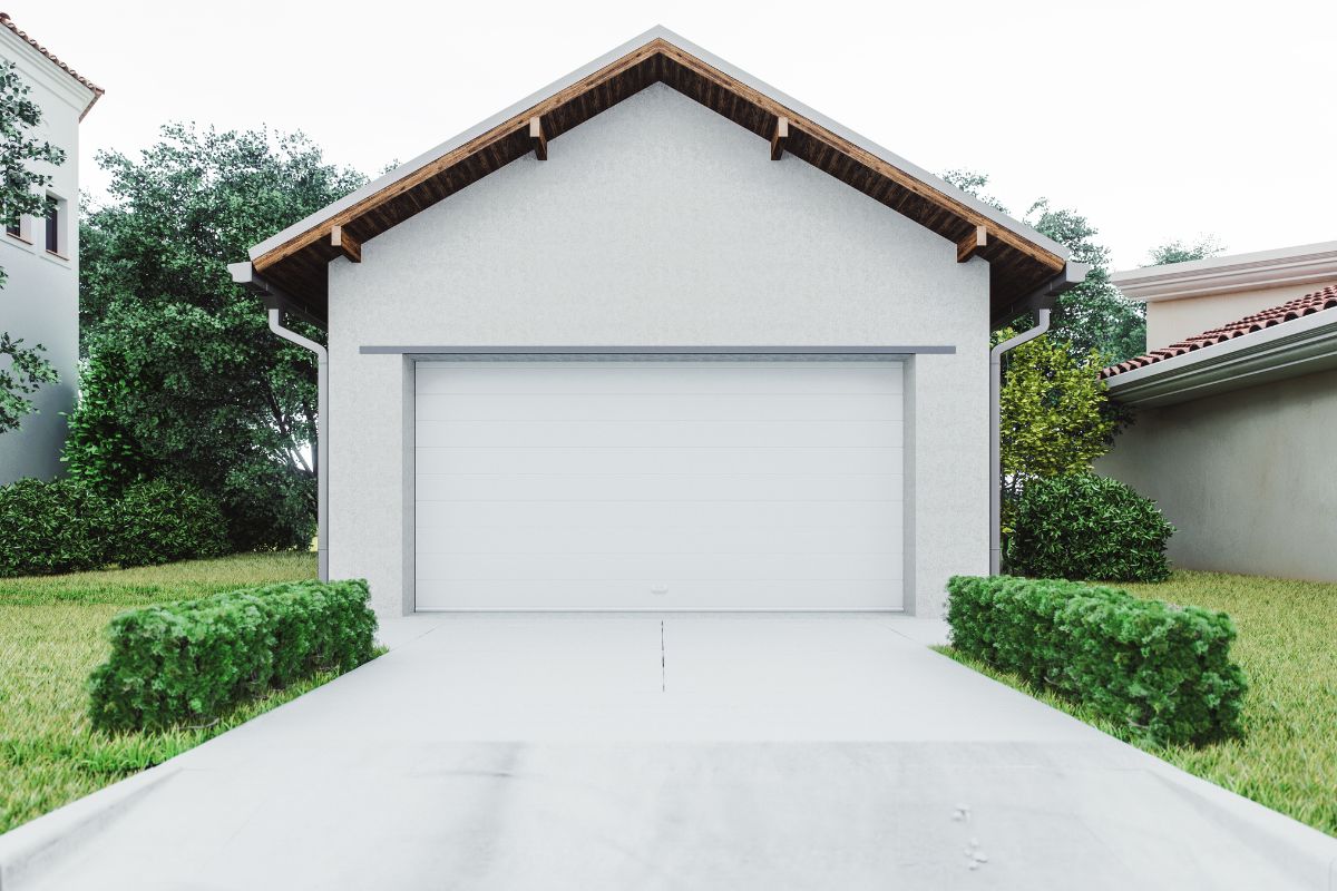 The picture is of a house with a driveway space.