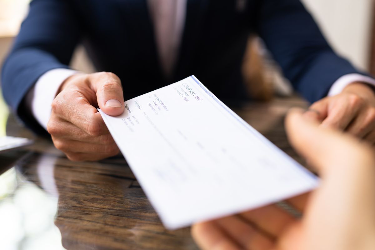 The photo shows an employee living paycheck to paycheck.