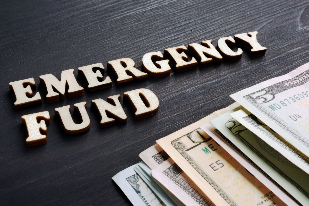 The picture is about dollar bills and emergency fund wording.