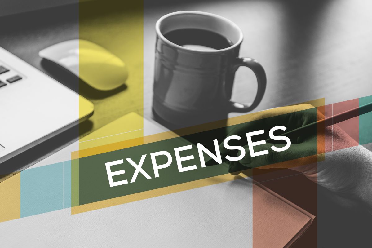 The image is about a man's hand differentiating the fixed vs variable expenses.