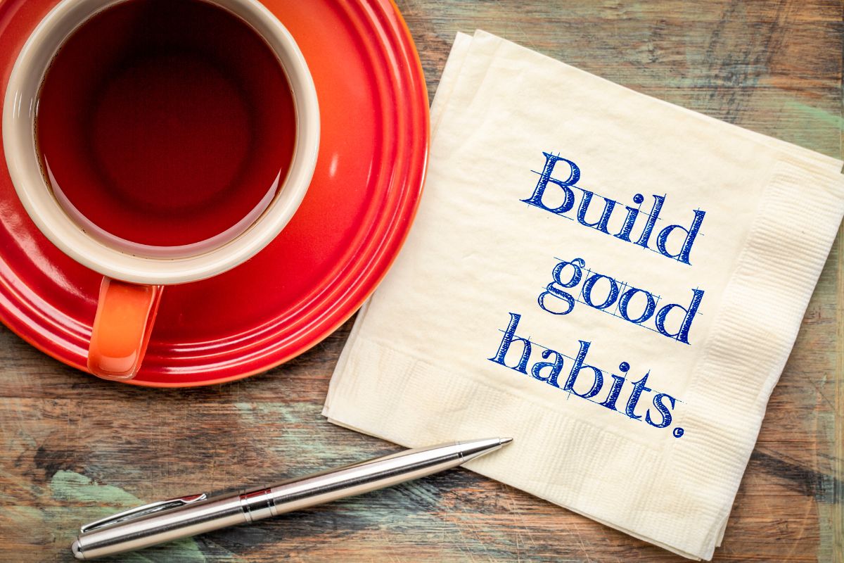 The photo shows a tea and a tissue with build good habits wording.
