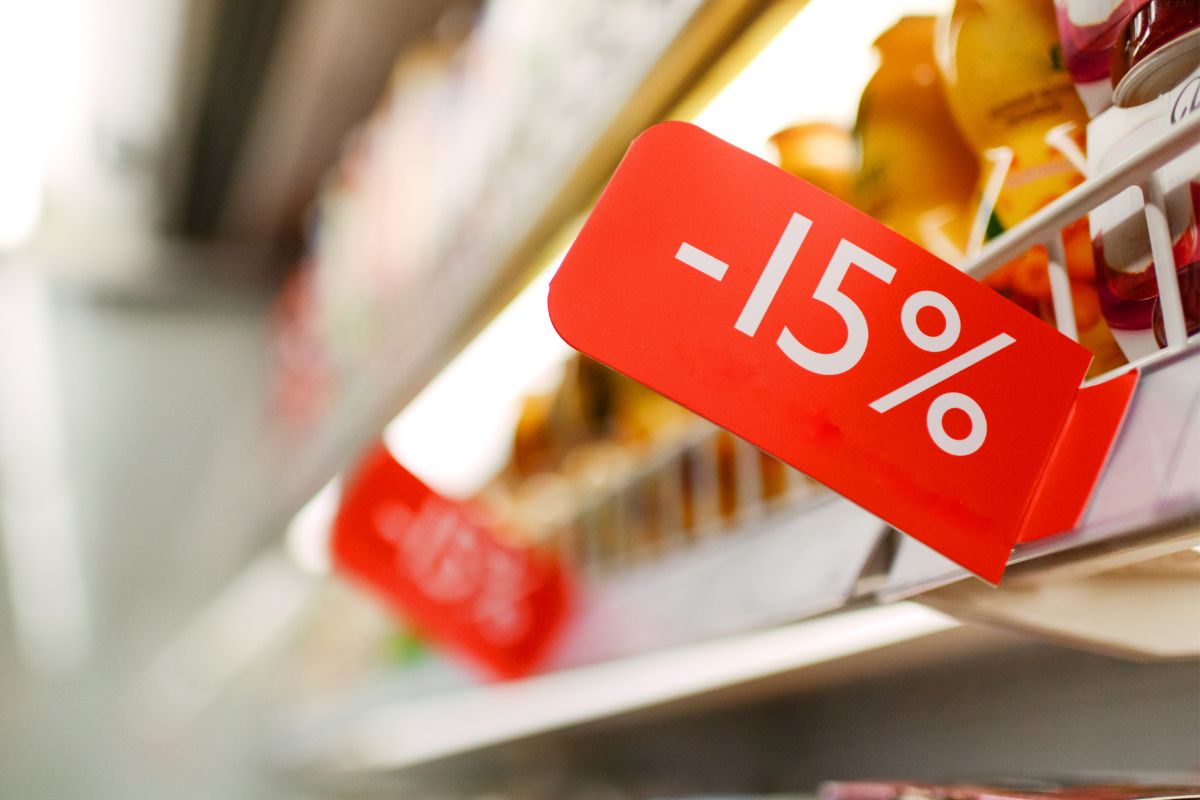 The picture is about a red sign that means discounted grocery stores.