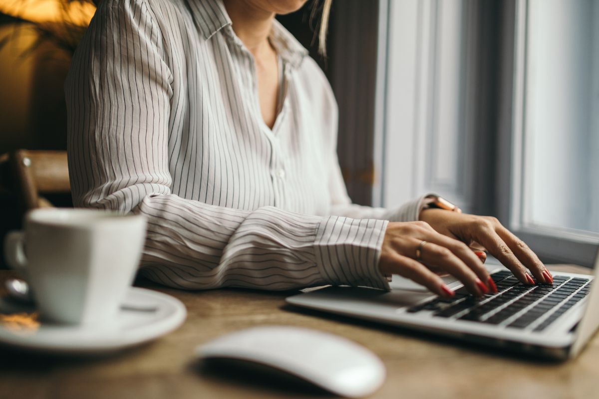 The picture of a virtual assistant working on her laptop.