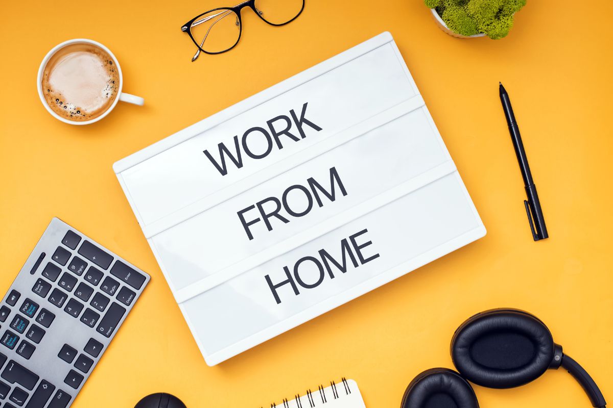 The photo shows a whiteboard with work from home wording.