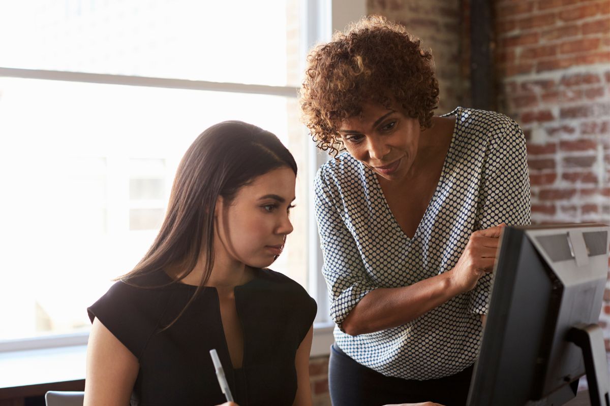 A picture of a mentor, educating her mentee.