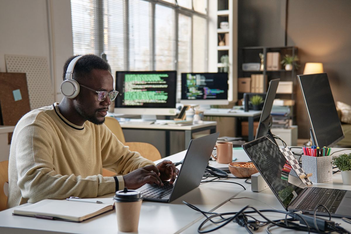 A man coding to improve cybersecurity.