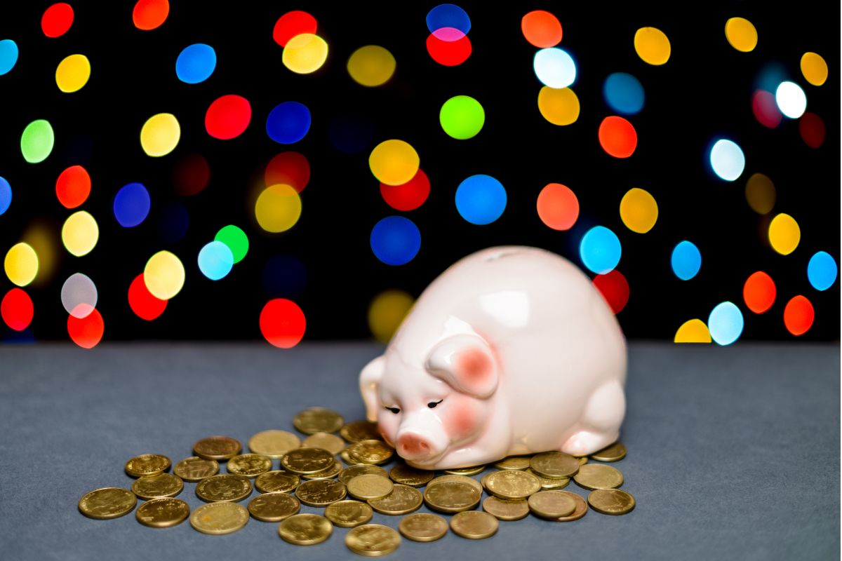 A picture of a piggy bank with money.