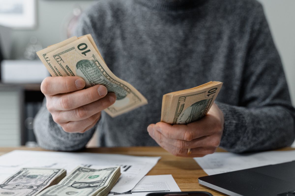 A picture of someone counting their money.