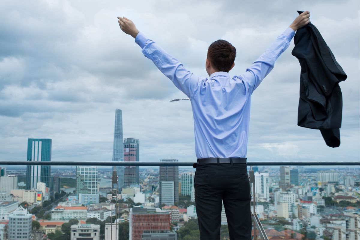 A picture of a man holding their hands up.