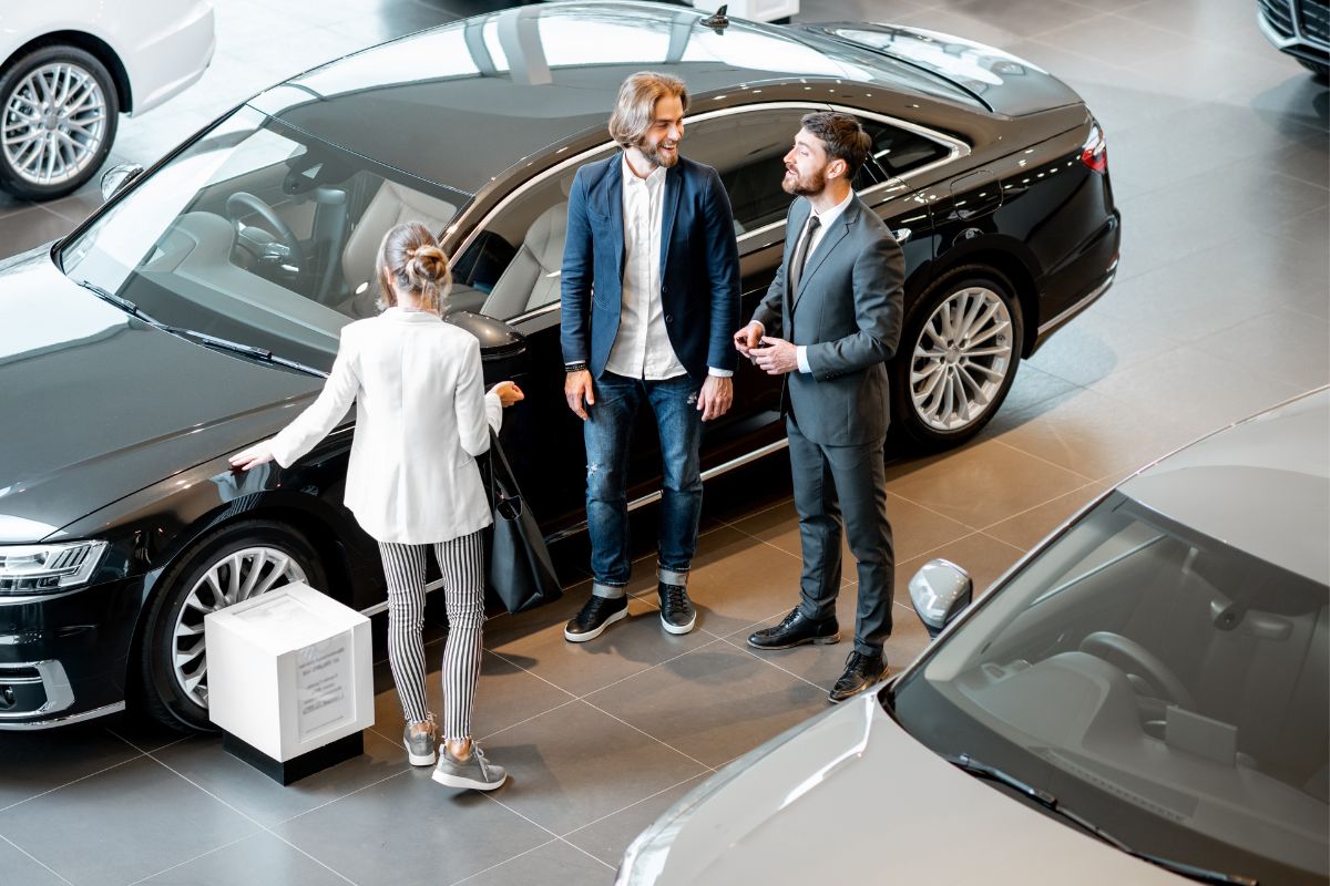 A picture of clients talking to a representative.