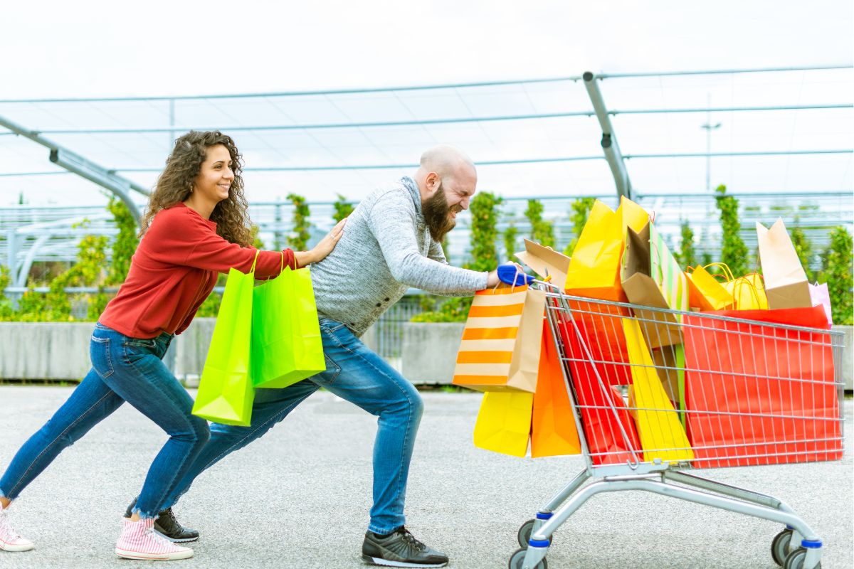 A picture of a couple that bought a lot of products.