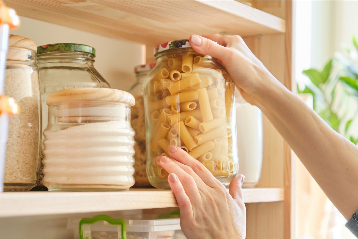 A picture of someone holding a jar. 