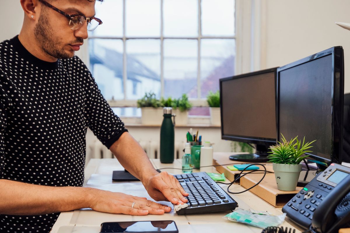 A picture of someone cleaning their computer.
