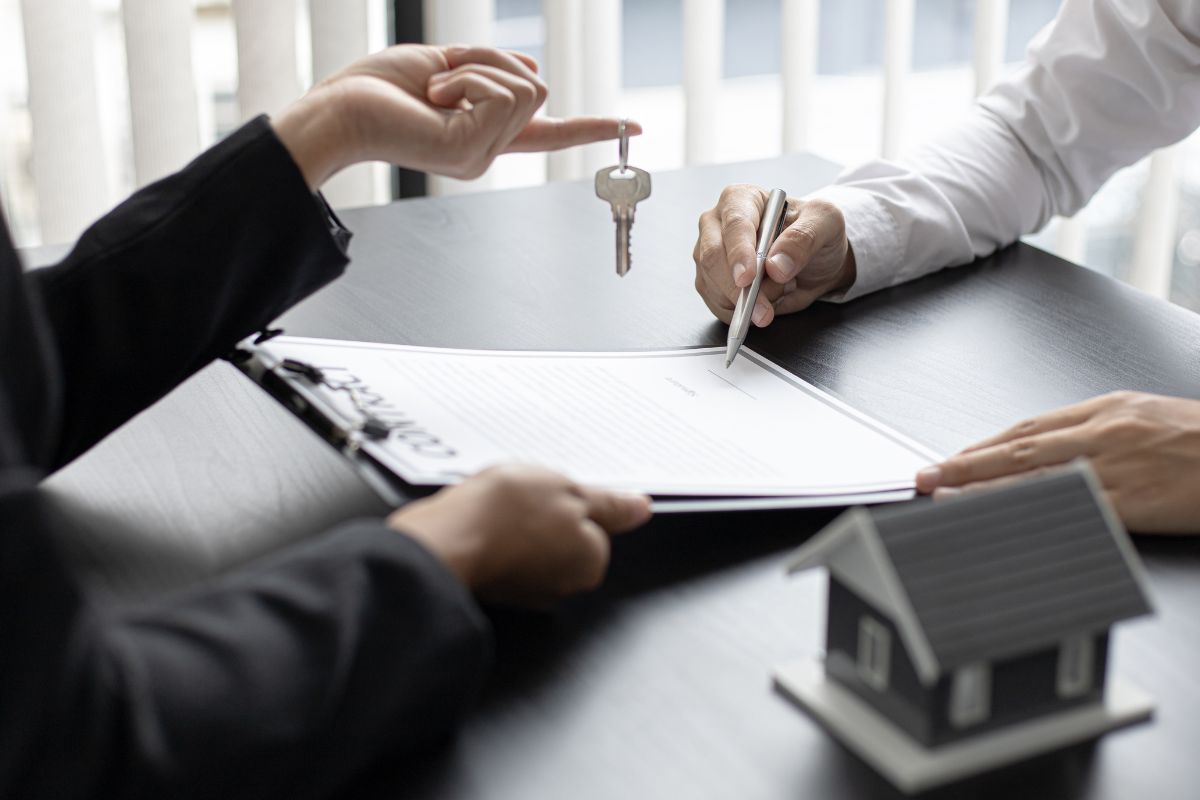 A picture of someone handling a key. 