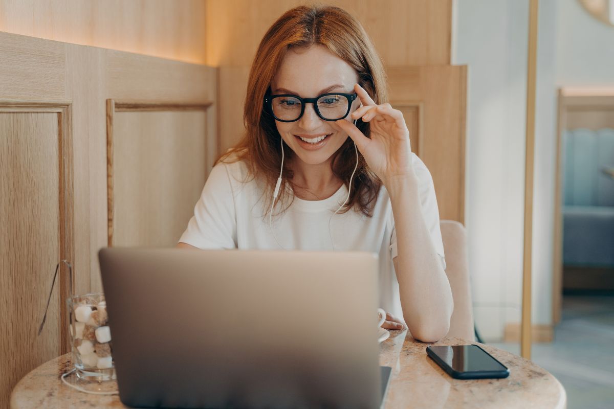 A picture of someone looking at their laptop.