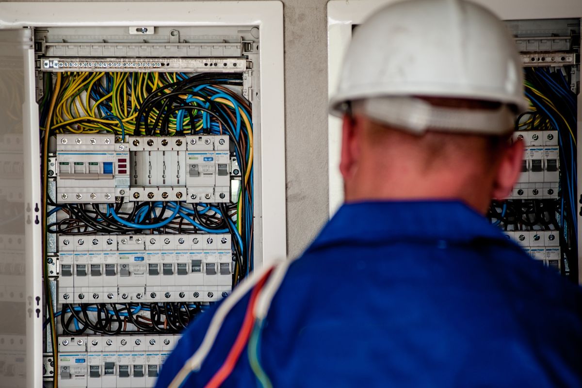 A picture of an engineer with wirings.