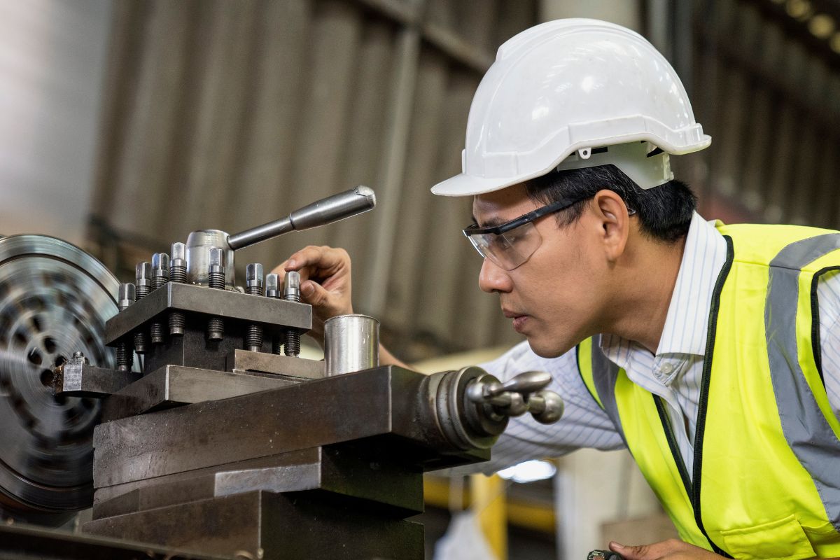 A picture of a mechanical engineer fixing mechanisms.