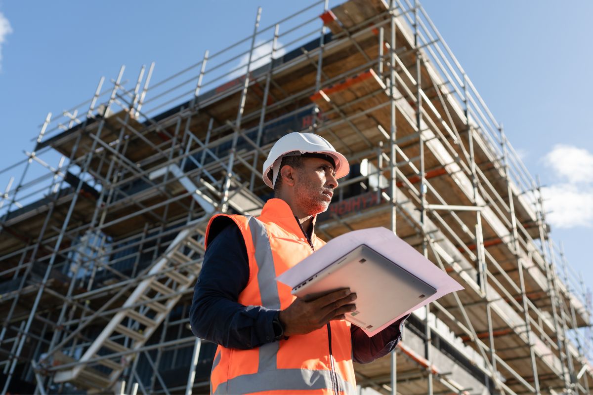 A picture of a civil engineer looking at the horizon.