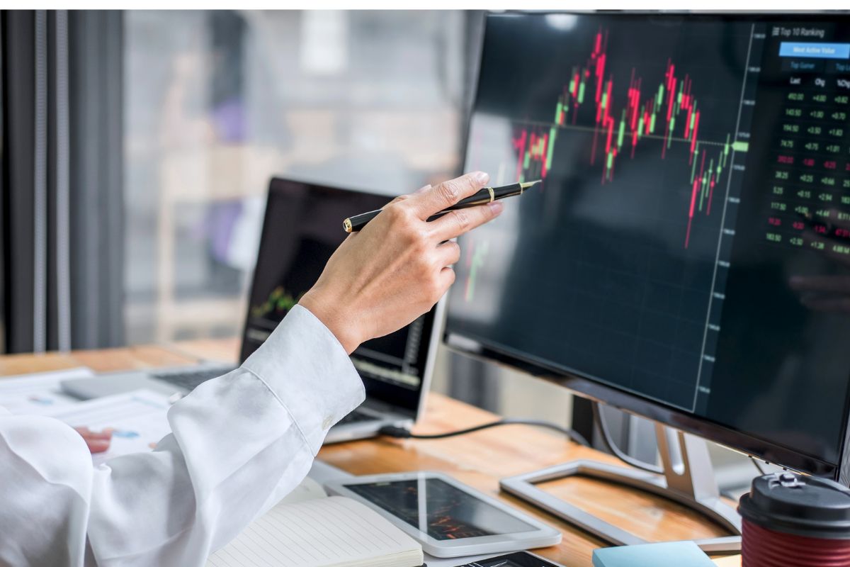 A picture of someone analyzing a graph.