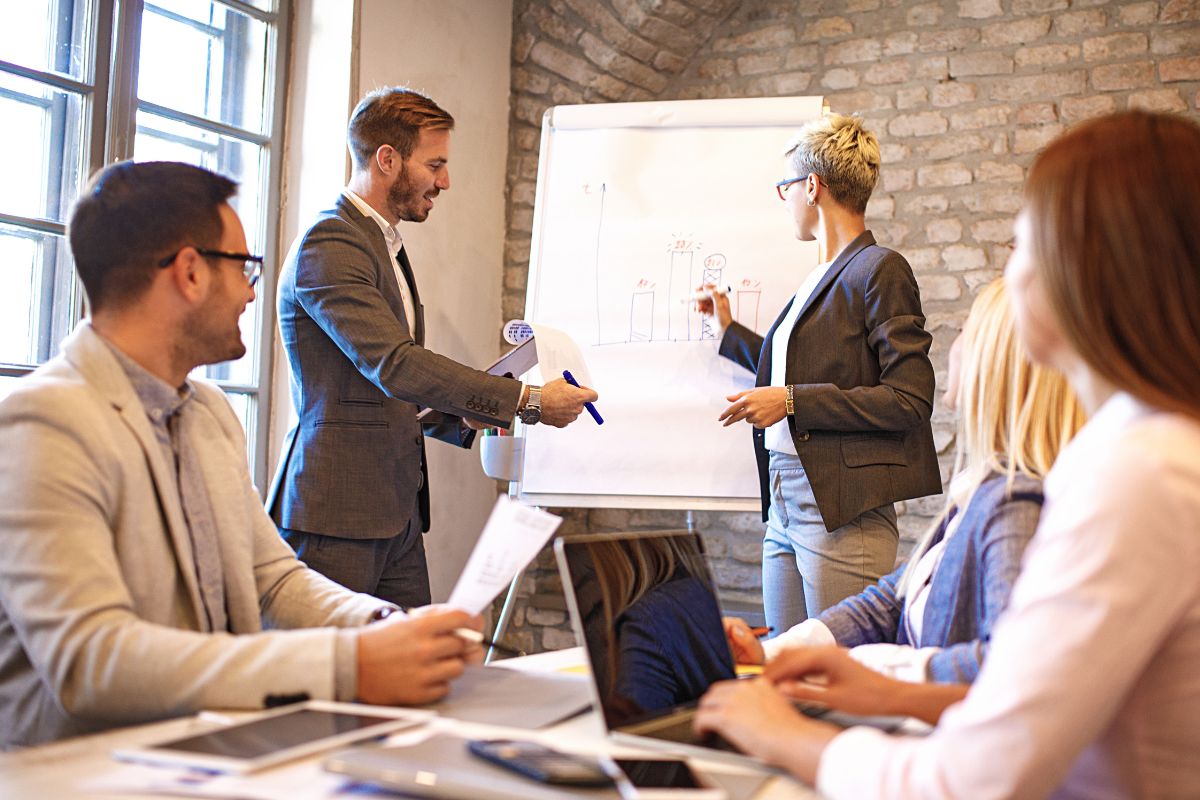 A picture of people in a meeting.