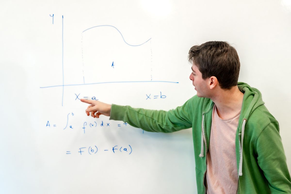 A picture of someone teaching math.