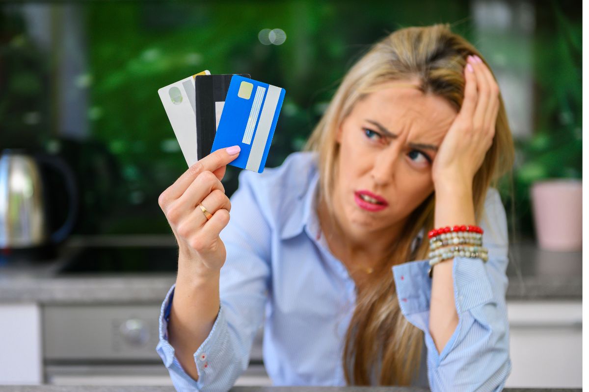 A picture of a lady with maxed out credit cards.