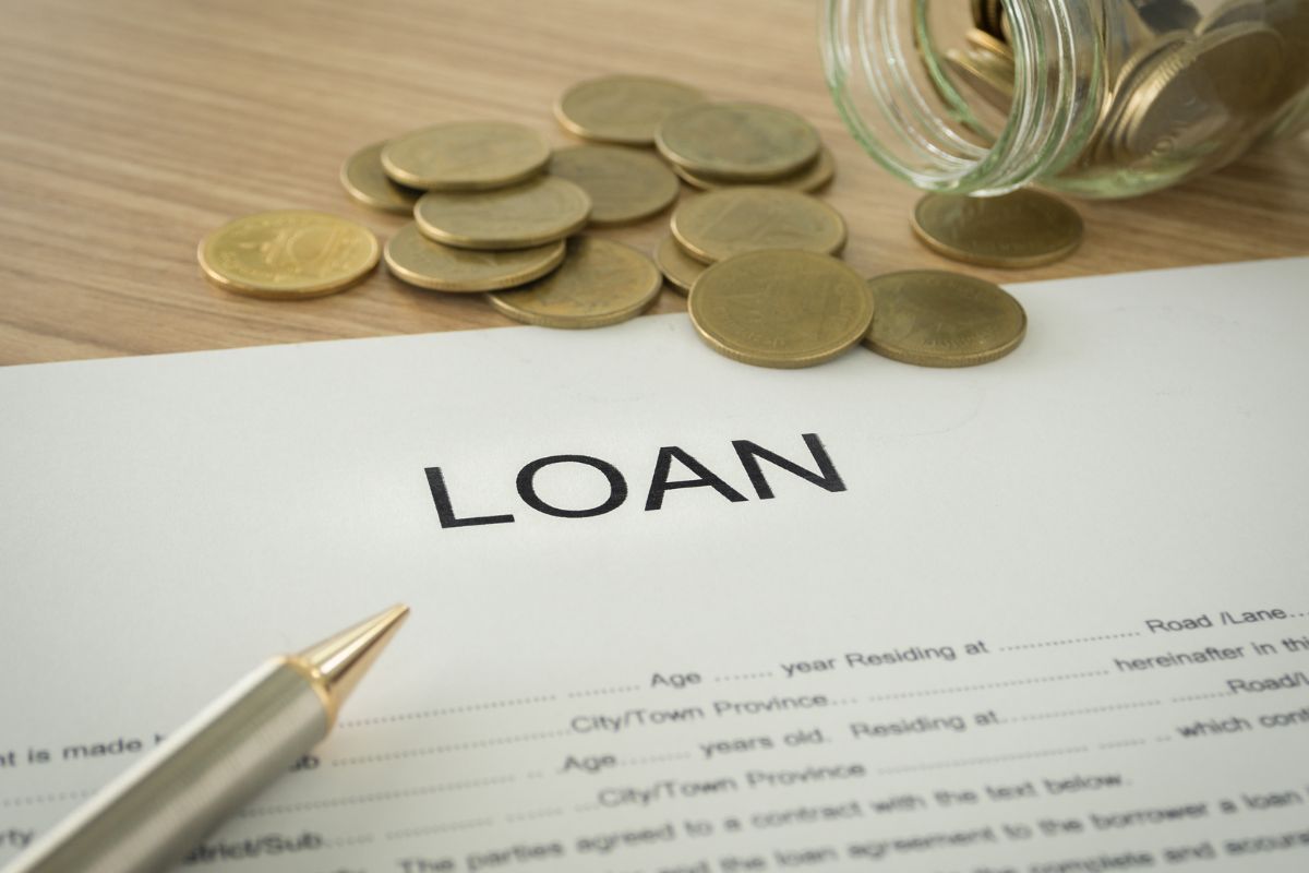 A picture of a loan with some coins.