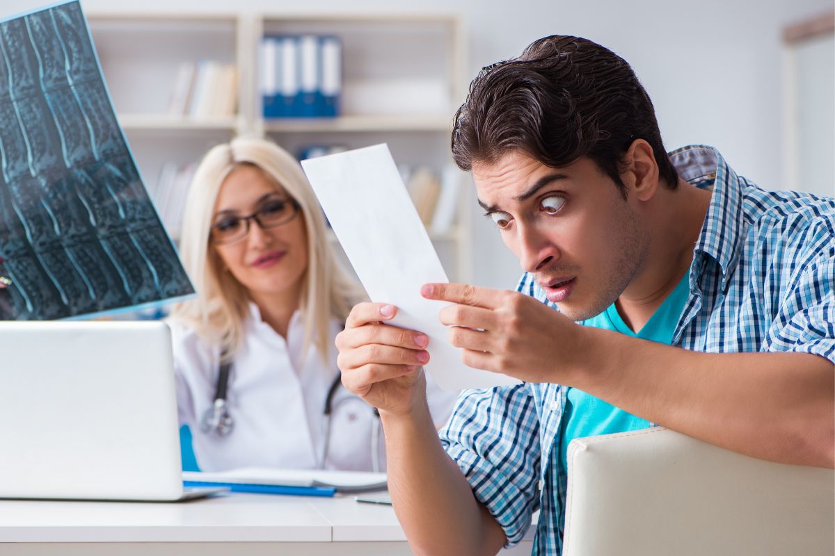 A picture of a man surprised with doctor's fees.