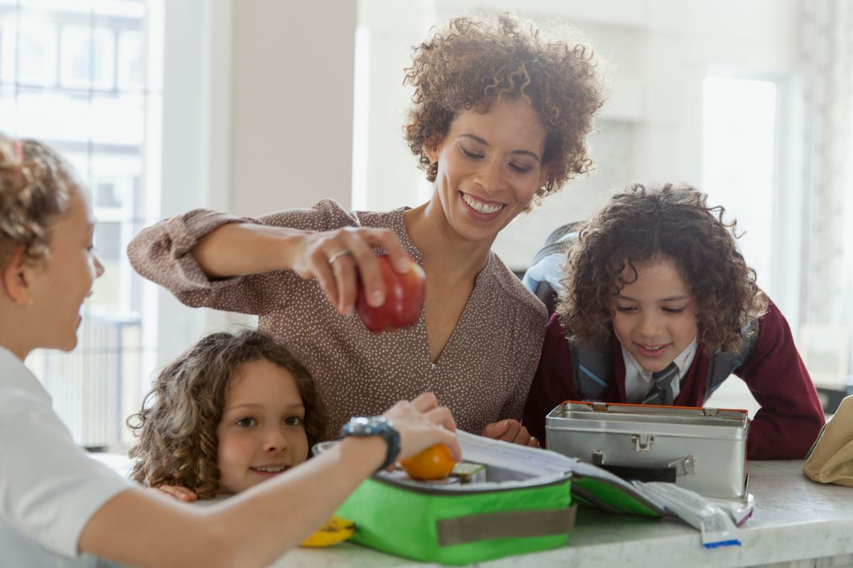 A picture of a family packing lunch. 