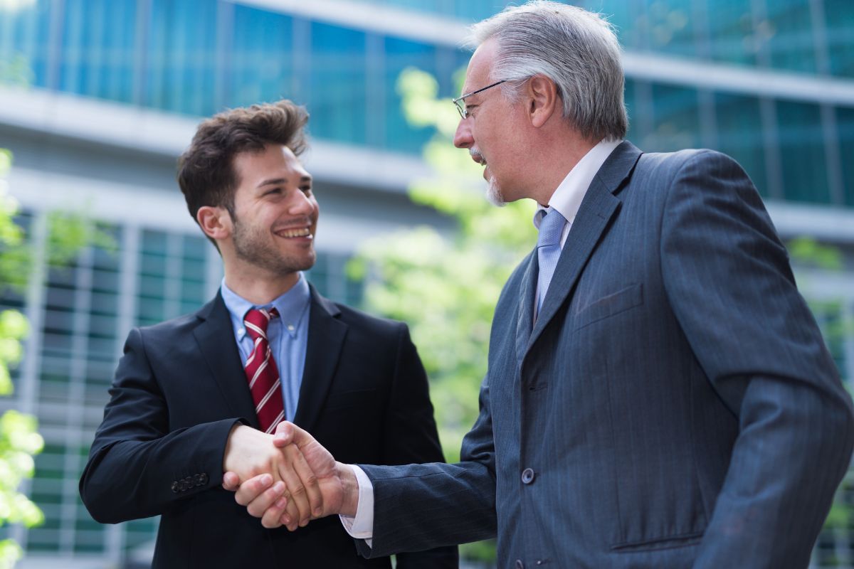 A picture of two men shaking hands. 