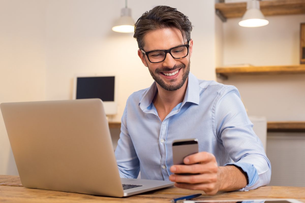 A picture of someone smiling at their phone. 