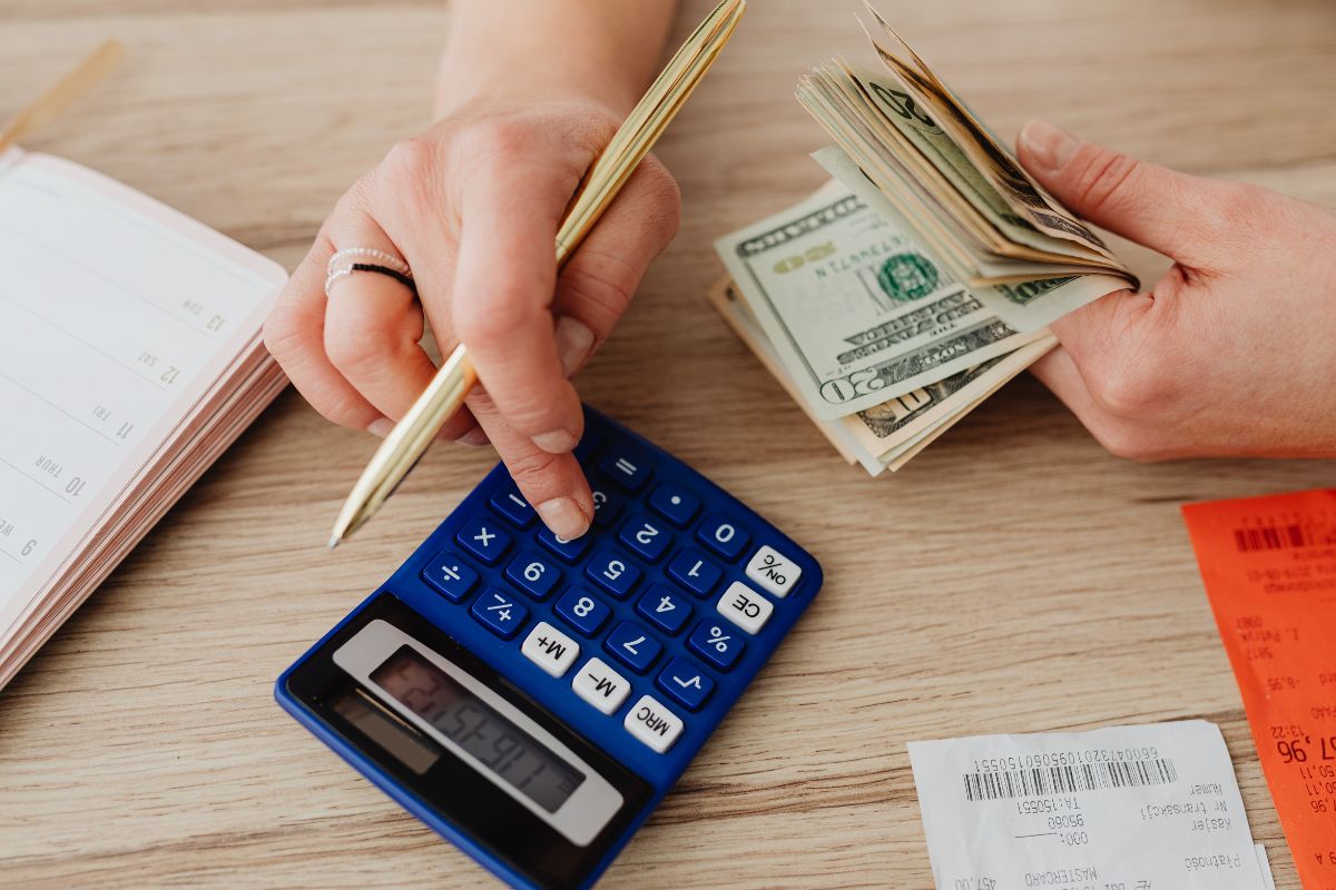 A picture of someone calculating their earnings. 