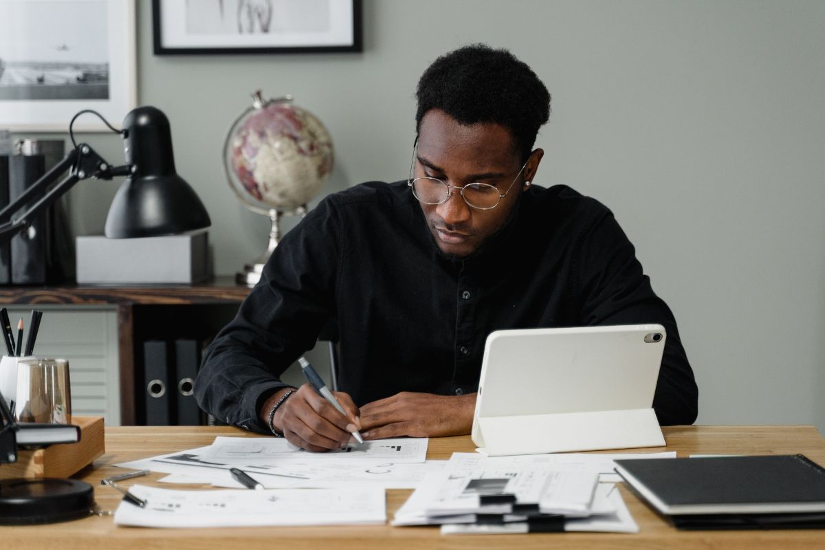 A picture of a man organizing his net worth.