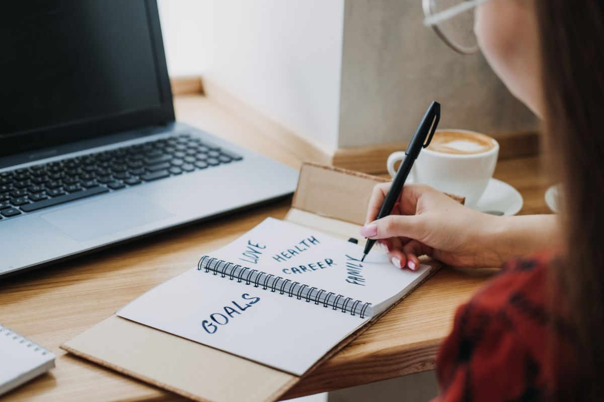 A picture of a lady planning for her goals.