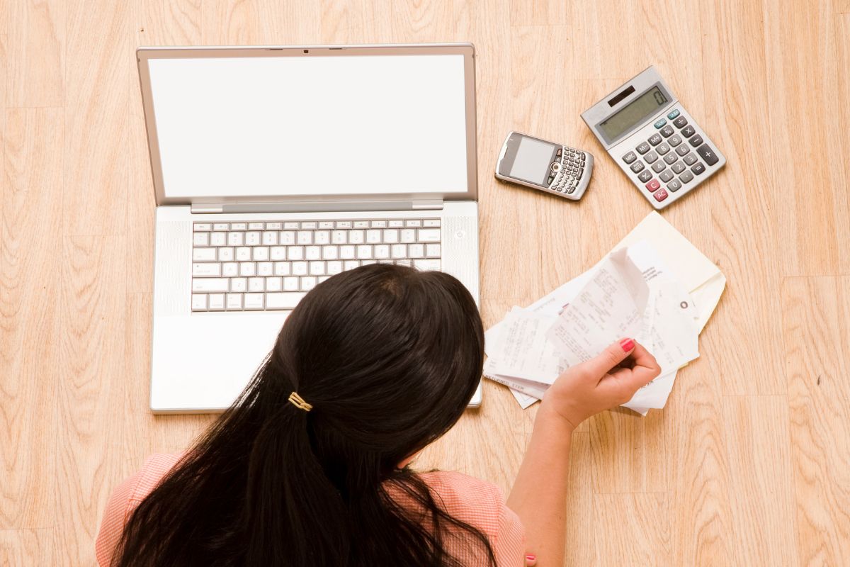 A picture of a lady checking her expenses.