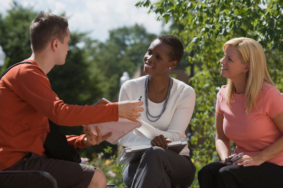 A picture of people talking to each other.