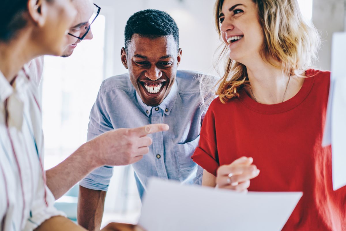 A picture of people smiling at work.